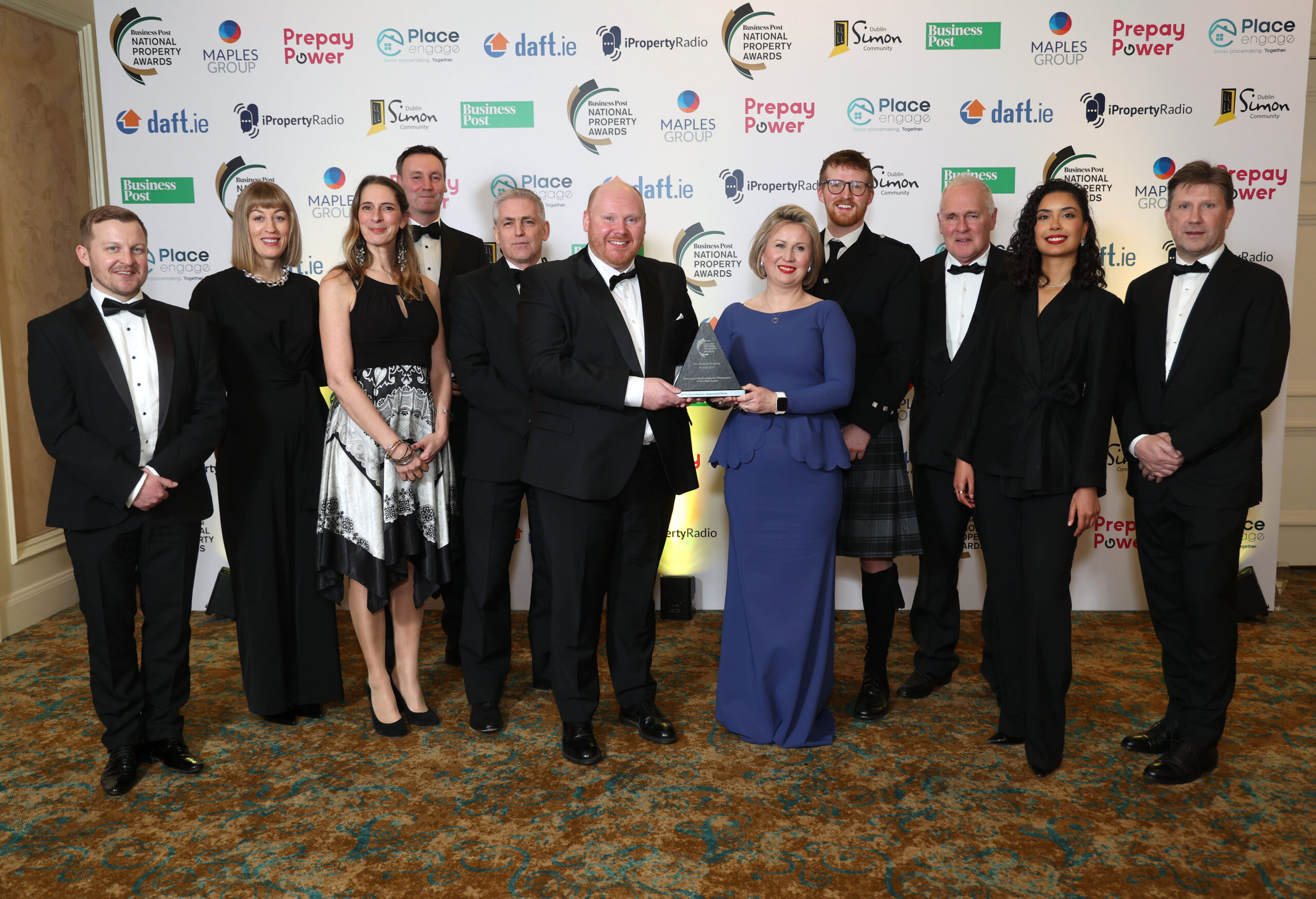 Thursday 27th February 2025; Seán O'Leary, Senior Planner with the Irish Planning Institute presents the award to Reddy Architecture: Newmarket Yards, winner of the Renovation/Redevelopment/Repurpose of the Year at the National Property Awards 2025, Intercontinental Hotel, Dublin. Picture Credit: Damien Eagers